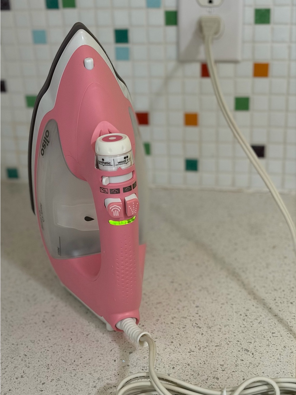 Open box Oliso TG 1600 ProPlus smart steam iron in rose pink, auto-lift feature!